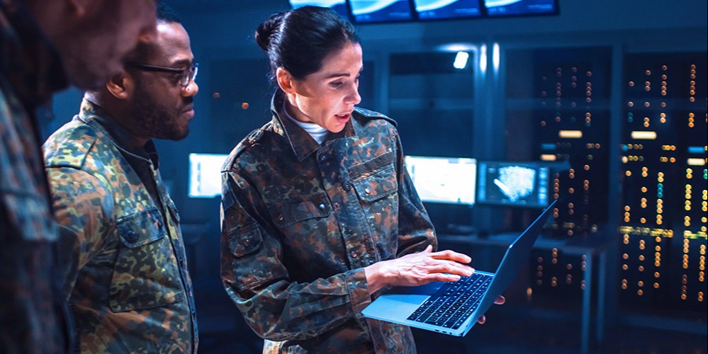 This is a photo of military personnel accessing AES-encrypted data on a computer.